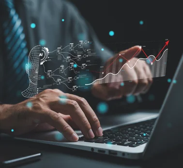 AI analytics concept with laptop, automation diagram, and business growth chart
